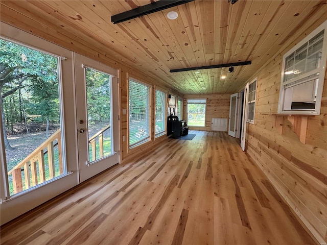 unfurnished sunroom with wooden ceiling