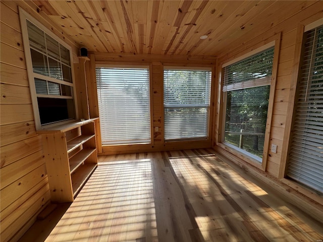 unfurnished sunroom featuring wooden ceiling