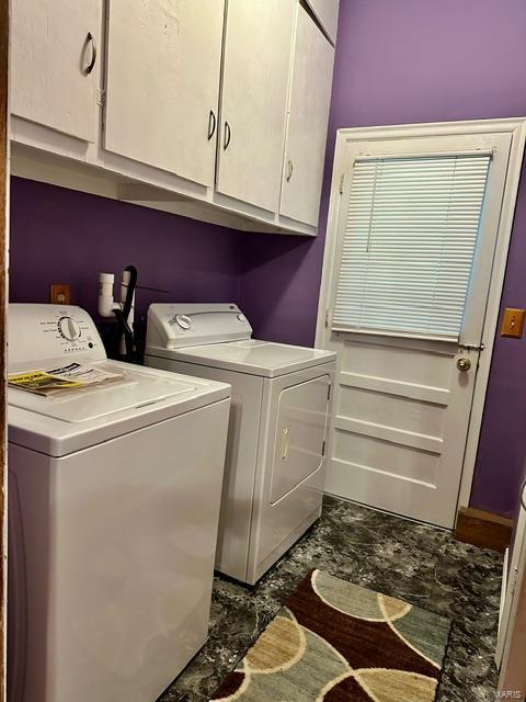 laundry area with cabinets and separate washer and dryer