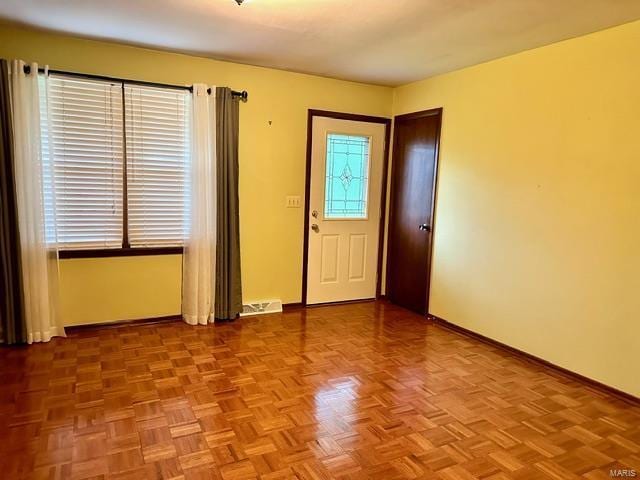 foyer with light parquet flooring