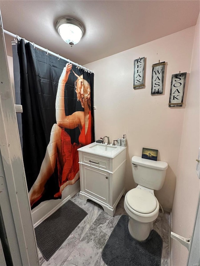 full bathroom featuring vanity, shower / tub combo, and toilet