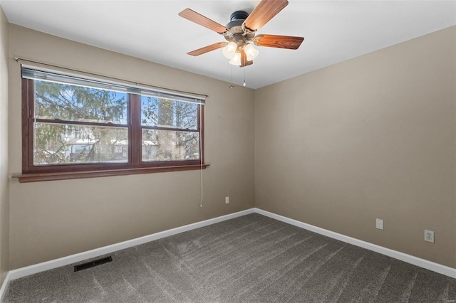 empty room featuring visible vents, baseboards, ceiling fan, and carpet flooring