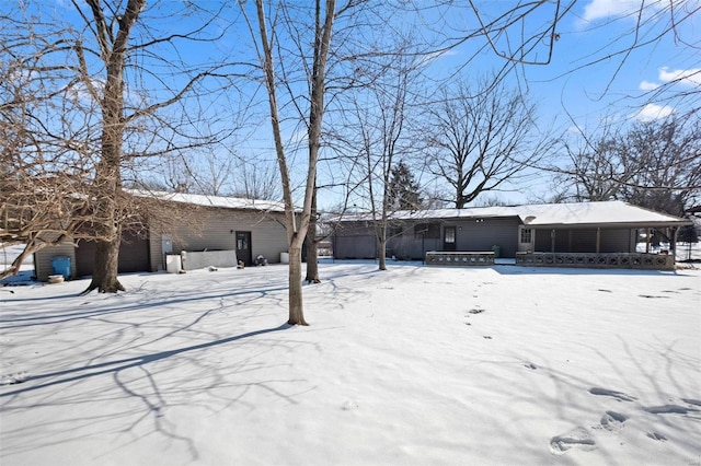 view of snow covered house