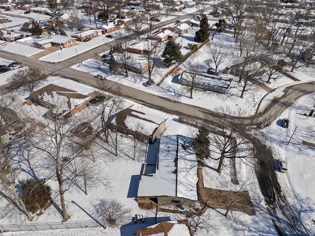 snowy aerial view with a residential view