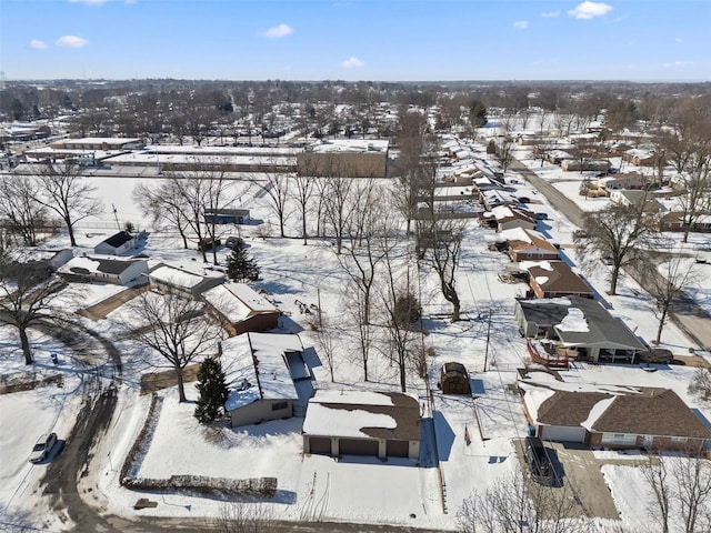 snowy aerial view featuring a residential view