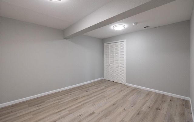 spare room featuring light wood-type flooring