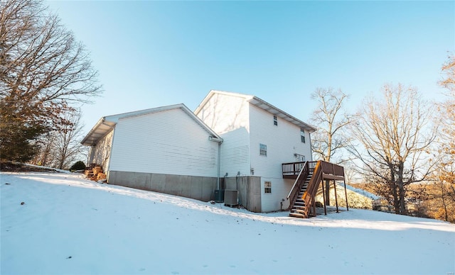 exterior space with cooling unit and a wooden deck