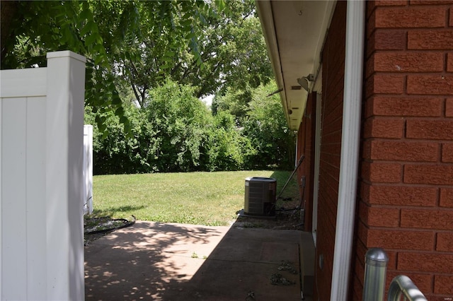 view of yard with a patio area and central AC unit