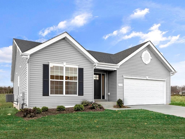 ranch-style house featuring a garage, central AC unit, and a front yard