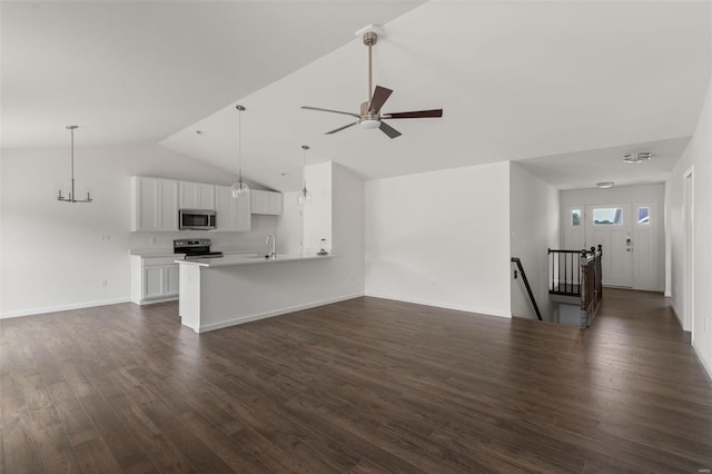 unfurnished living room with sink, dark wood-type flooring, lofted ceiling, and ceiling fan