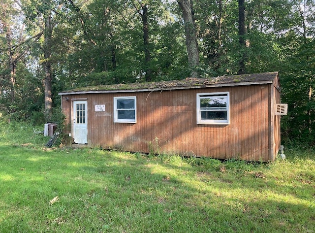 view of outdoor structure with a lawn