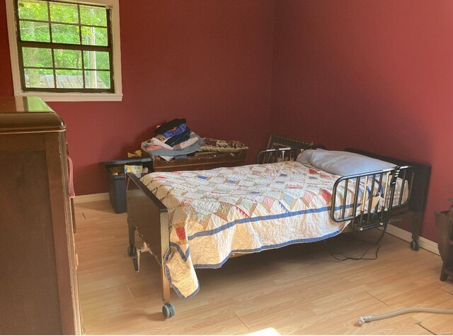 bedroom featuring wood-type flooring