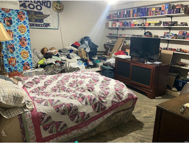 bedroom with hardwood / wood-style floors