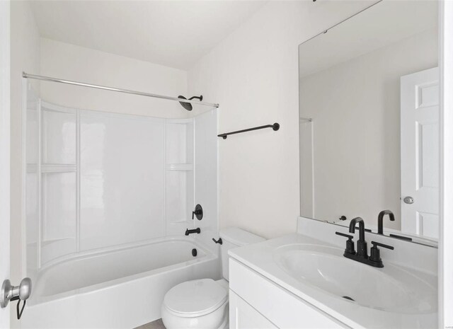 full bathroom featuring toilet, vanity, and tub / shower combination