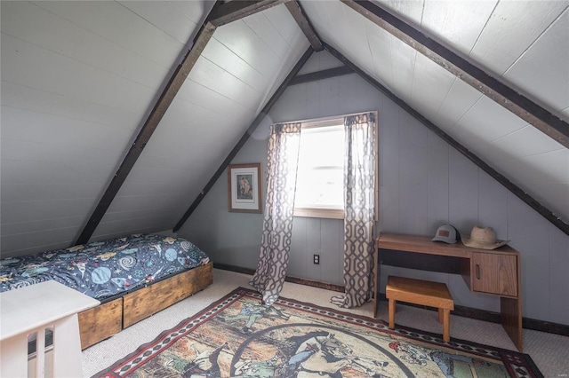 bedroom with vaulted ceiling with beams and light colored carpet