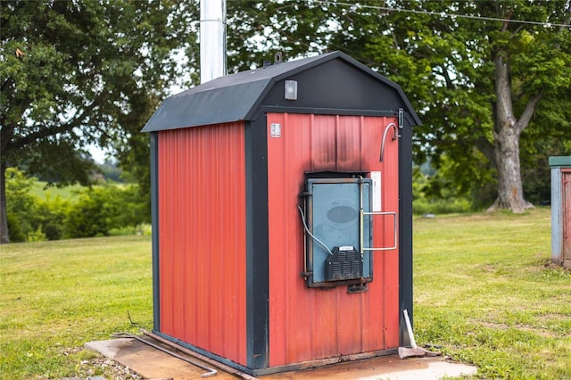 view of outbuilding featuring a yard