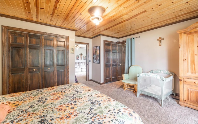 carpeted bedroom with ornamental molding and wood ceiling