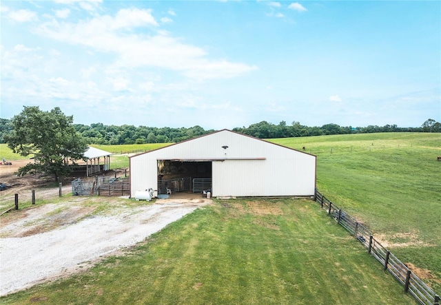 view of outbuilding featuring a rural view