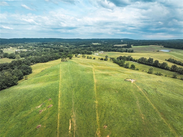 birds eye view of property with a rural view