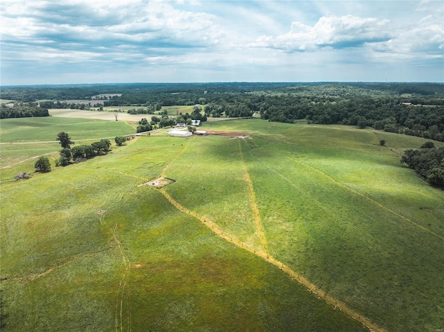 birds eye view of property with a rural view