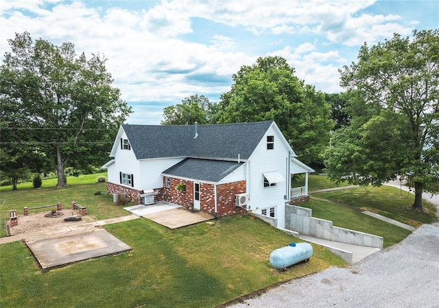 view of front of house featuring a patio area and a front yard