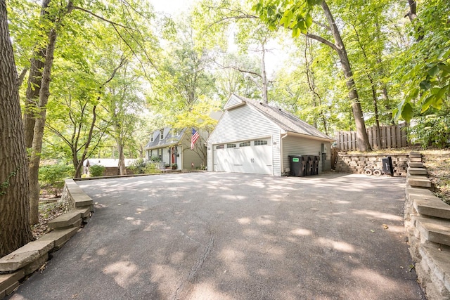 view of side of property with a garage