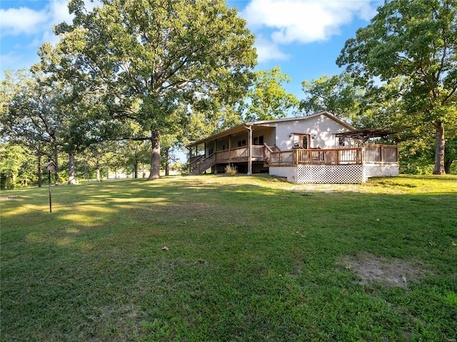 view of yard with a wooden deck