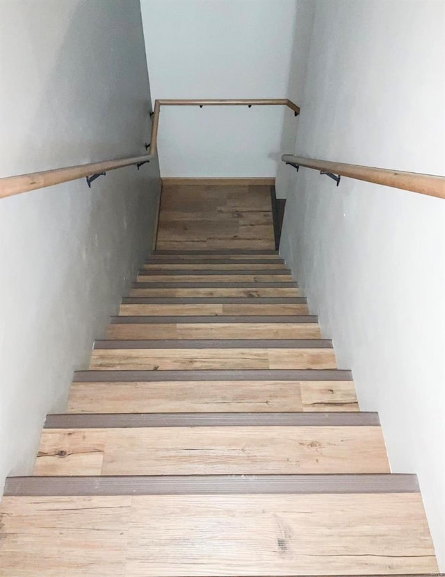 stairway with wood-type flooring