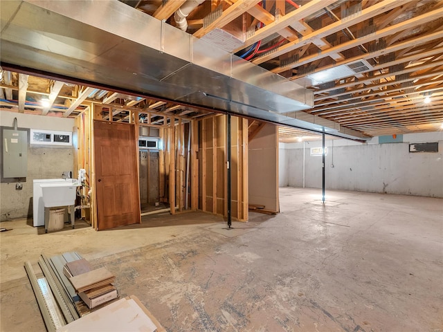 basement with sink and electric panel