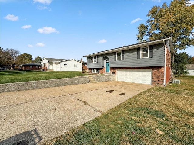 split foyer home with a front lawn and a garage