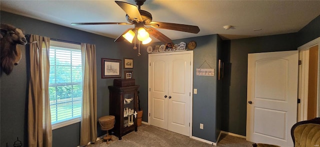 bedroom featuring multiple windows, carpet, and ceiling fan