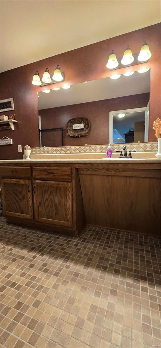 bathroom with tile patterned flooring and vanity