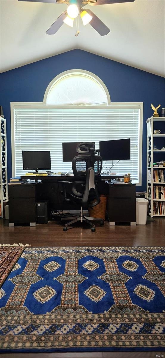 office area with ceiling fan, dark hardwood / wood-style flooring, and vaulted ceiling