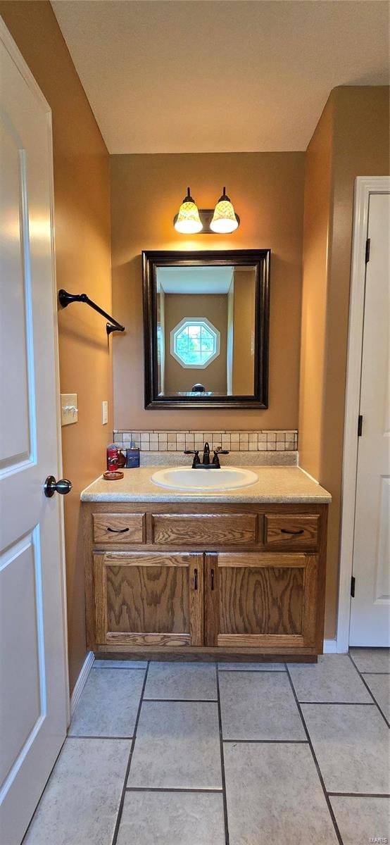 bathroom featuring tile patterned floors and vanity