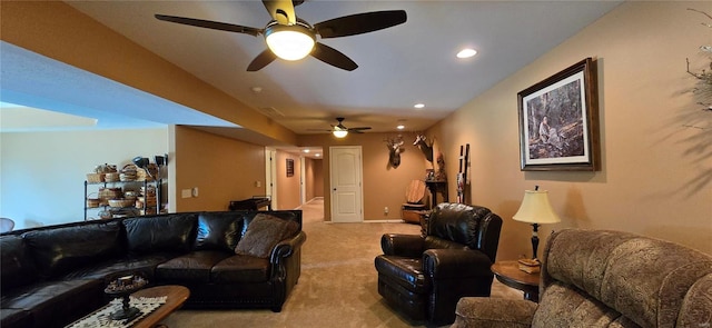 carpeted living room with ceiling fan