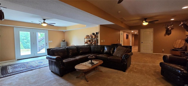 living room with carpet flooring, a textured ceiling, french doors, and ceiling fan