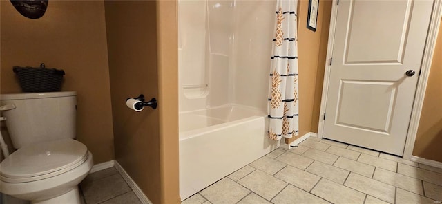 bathroom with tile patterned flooring, toilet, and shower / bath combination with curtain