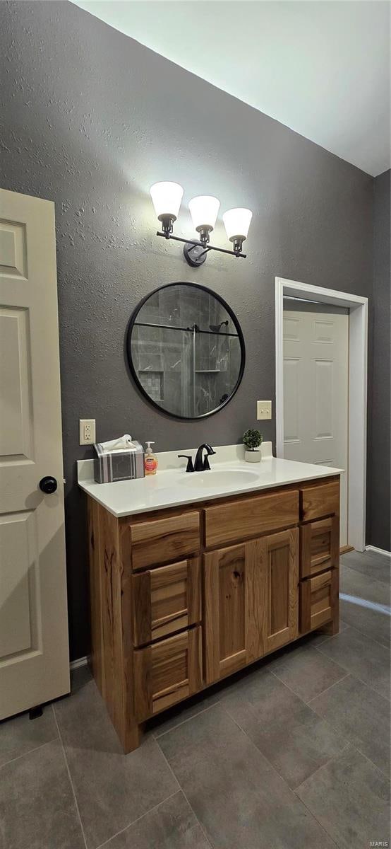 bathroom featuring vanity and tile patterned flooring