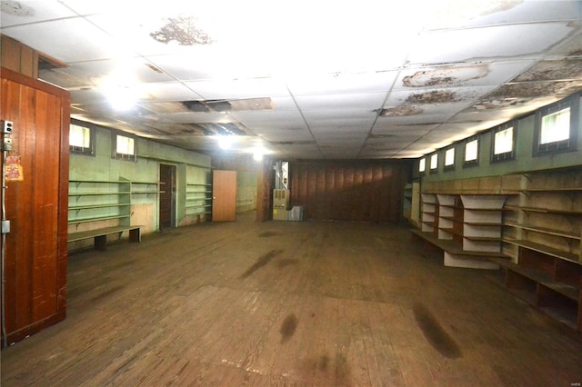 basement featuring a paneled ceiling