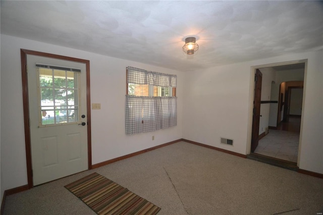 entrance foyer featuring carpet