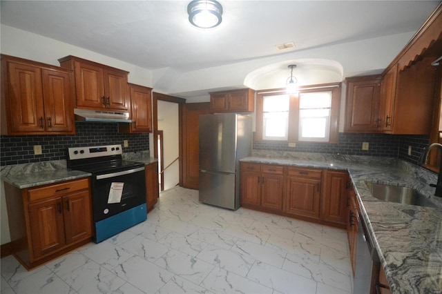 kitchen with backsplash, sink, appliances with stainless steel finishes, and dark stone counters