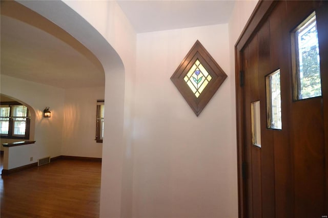 corridor featuring hardwood / wood-style floors