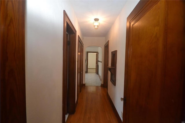 corridor featuring wood-type flooring