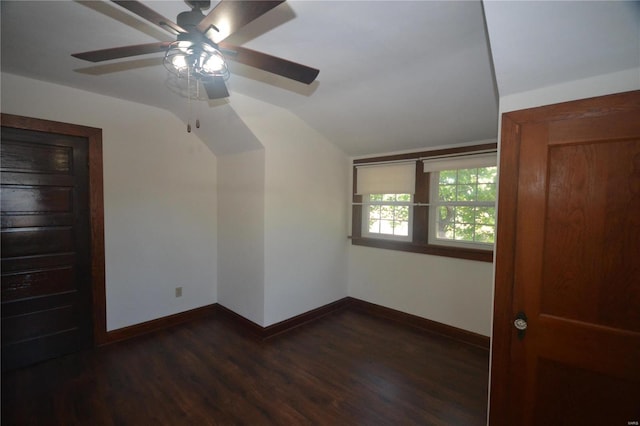 interior space featuring dark hardwood / wood-style flooring, ceiling fan, and lofted ceiling