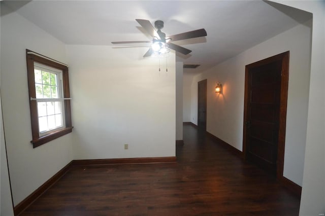 unfurnished room featuring ceiling fan and dark hardwood / wood-style floors