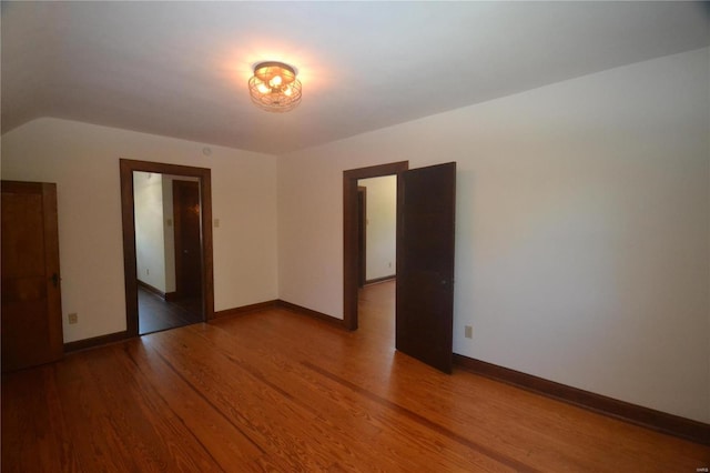 spare room with wood-type flooring