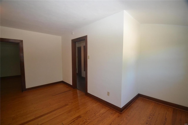 spare room with hardwood / wood-style flooring