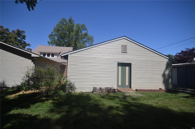 view of property exterior featuring a yard