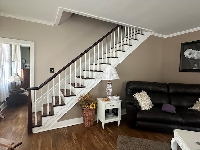 living room with wood-type flooring and ornamental molding