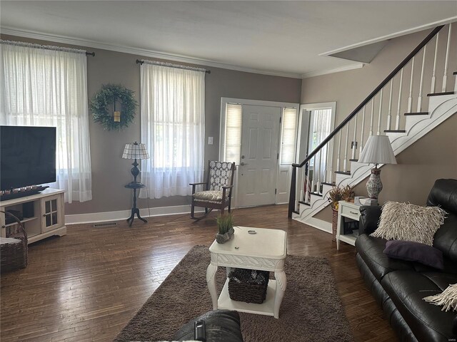 living room featuring crown molding and dark hardwood / wood-style floors